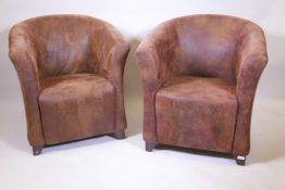 A pair of brown suede style tub chairs, 33" high