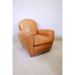 A deep black tan leather armchair, 32½" high