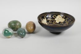 A Chinese Jian Kiln pottery bowl with floral decoration, together with four hardstone decorative