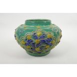 A Chinese green ground pottery vase with raised yellow and blue floral decoration, 9" diameter
