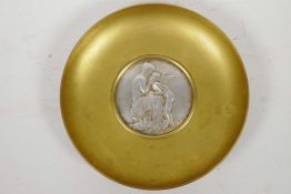 An ormolu shallow bowl by Jollet Paris with central white metal medallion depicting Aphrodite and