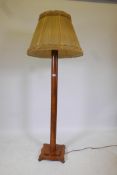 An Art Deco standard lamp with moulded column and stepped shaped base, 55" high