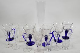 Five custard glasses with clear bowls and blue stems, and handles, together with six engraved