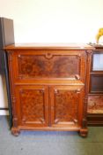 A C19th continental secretaire abattant with burr walnut panels, the fall front fitted with an