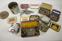 A box of vintage tins and detectorist finds