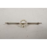 A 9ct white gold bar brooch with ten seed pearls, 2¼? long, 2.7g