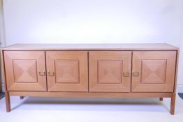 A mid century teak sideboard of four drawers, 84" x 20", 33½" high