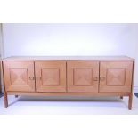 A mid century teak sideboard of four drawers, 84" x 20", 33½" high