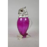 A glass and silver plate claret jug in the form of an owl with glass set eyes, 11" high