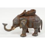 A cast iron elephant money box, 5" high