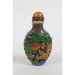 A Peking glass snuff bottle with carved and enamelled decoration of birds, butterflies, flowers