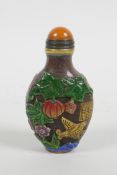 A Peking glass snuff bottle with carved and enamelled decoration of birds, butterflies, flowers