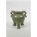 A Chinese olive crackle glazed pottery censer with two dragon handles and tripod supports, 6" high