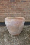 A large terracotta pot, A/F crack, 17½" high x 20½" diameter