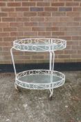 A painted wrought metal two tier conservatory table, 17½" x 25", 26" high