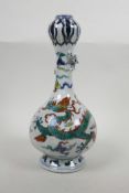 A Chinese garlic head shaped porcelain vase with doucai dragon decoration and an applied climbing