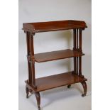 A mahogany three tier buffet with a three quarter gallery, raised on pierced and turned ends