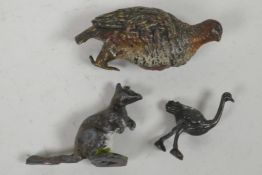 A cold painted bronze figurine of a grouse, 3" high, A/F, together with a small cast metal
