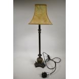 A late C20th bronze toleware candlestick table lamp, with cast brass elephants to the base and