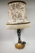 An open double twist table lamp on swept octagonal base, comes with shade, 26½?