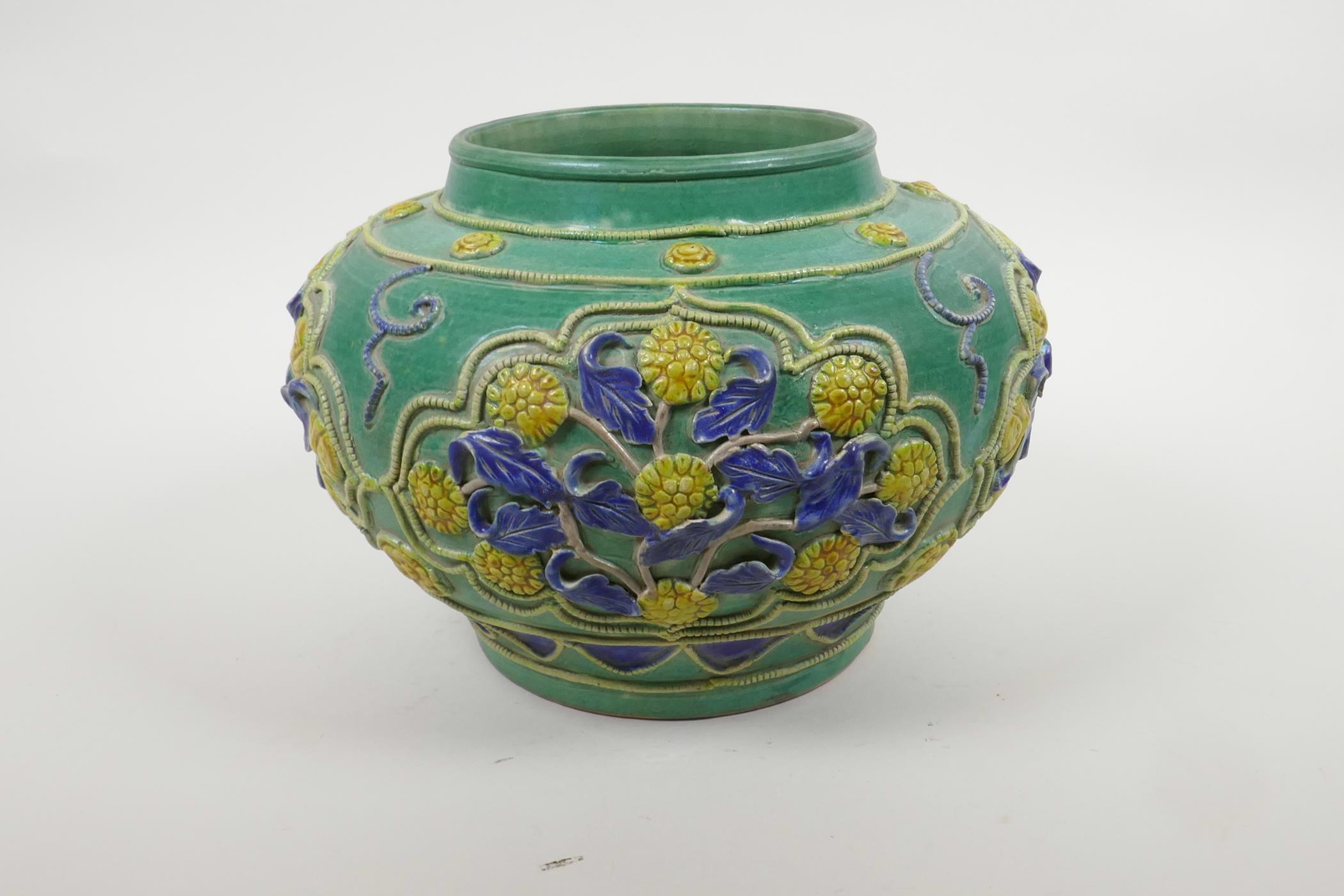 A Chinese green ground pottery vase with raised yellow and blue floral decoration, 9" diameter - Image 3 of 5