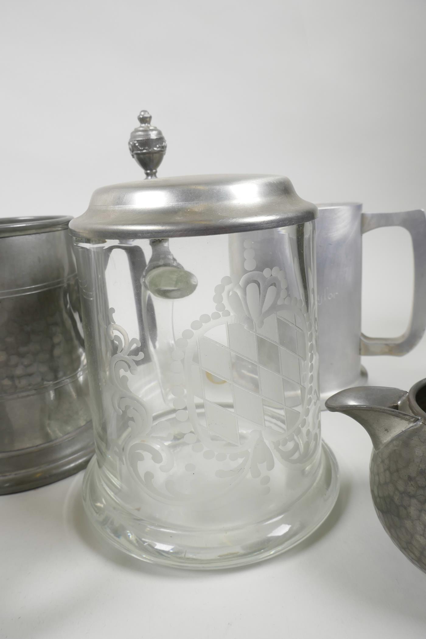 Five pewter tankards, a pewter cream jug and an engraved glass tankard with pewter lid, 6½" high (7) - Image 2 of 2