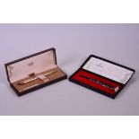 A Cross 14kt rolled gold fountain pen with 14kt gold medium nib, in its original case, along with