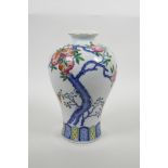 A Chinese polychrome enamelled porcelain meiping vase decorated with bats and a pomegranate tree,