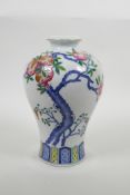 A Chinese polychrome enamelled porcelain meiping vase decorated with bats and a pomegranate tree,