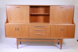 A 1970s G-Plan teak 'fresco' side cabinet designed by Victor Wilkins, 74" x 18", 48" high