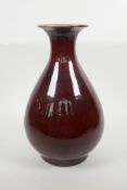 A Chinese flambe glazed pottery pear shaped vase, 13" high