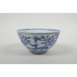 A Chinese blue and white porcelain rice bowl decorated with deer in a landscape, six character