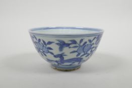 A Chinese blue and white porcelain rice bowl decorated with deer in a landscape, six character