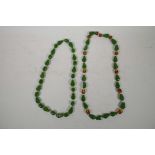 A two tone amber style bead necklace and a green amber style bead necklace, 30" longest