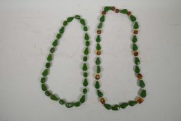 A two tone amber style bead necklace and a green amber style bead necklace, 30" longest