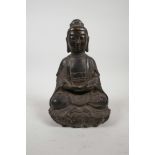 A Chinese bronze Buddha seated on a lotus throne, 8" high