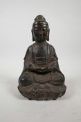 A Chinese bronze Buddha seated on a lotus throne, 8" high