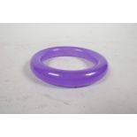 A reconstituted and dyed jade bangle, 3½" diameter