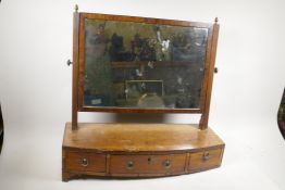 A Victorian mahogany swing toilet mirror on bow feet, three drawer base and reeded supports, A/F,