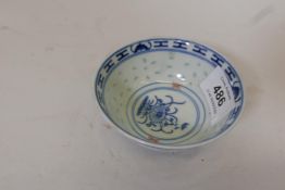 A Chinese rice bowl with blue and white decoration, and gilt and iron red highlights, signed to