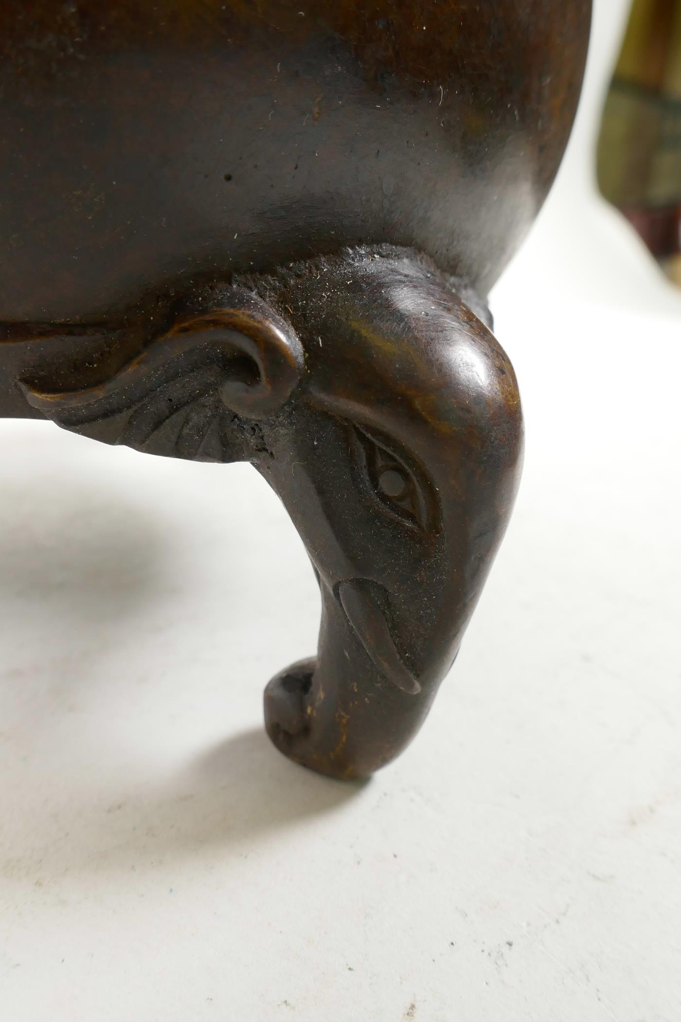 A Chinese bronze barrel shaped censer with two elephant mask handles and elephant knop, raised on - Image 3 of 5