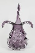 An amethyst studio glass vase with leaf pattern neck and textured body