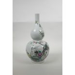 A Chinese double gourd porcelain vase with polychrome enamelled decoration of cranes amongst a peach
