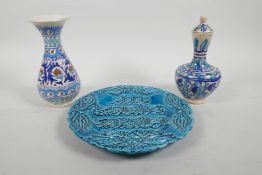A Turkish Kutahya pottery pear shaped vase with Iznik decoration, together with a similar pottery