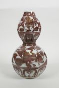 A Chinese red and white porcelain double gourd vase with phoenix decoration, 9" high