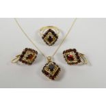 A suite of 14ct yellow gold and garnet set jewellery including a ring, pendant necklace and pair