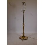 A brass standard lamp on a hexagonal form base, 62" high