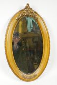 A carved Victorian wood and gilt mirror with hanging brass chain to the reverse, 22" long x 13" wide