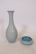 A Chinese celadon glazed porcelain pear shaped vase, 16½" high, together with a blue crackle