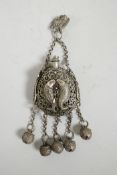 A Chinese pierced white metal scent holder pendant with carp and bell decoration, impressed